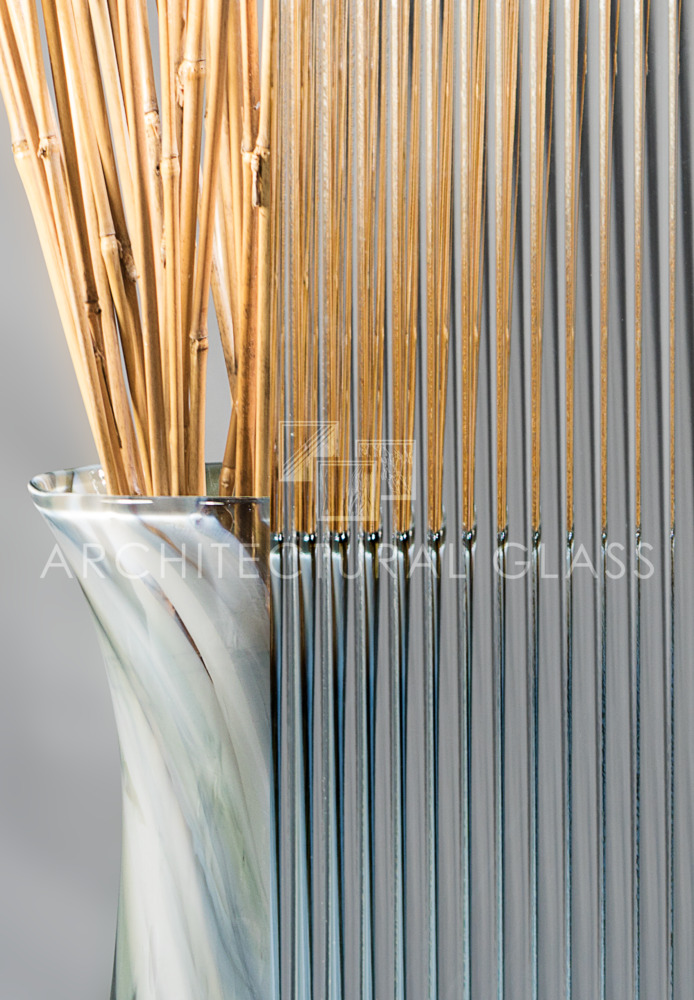 vase-holding-bamboo-behind-reeded-glass-panel